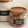 Ancho Hocking Montana glass canisters with acacia lids labeled Danielle Walker